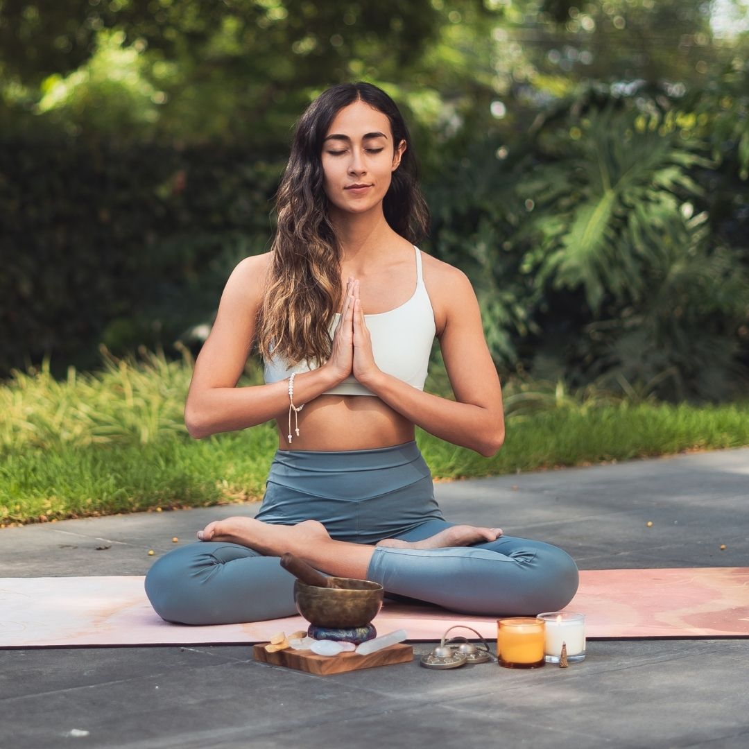 the girl in the photo is meditating