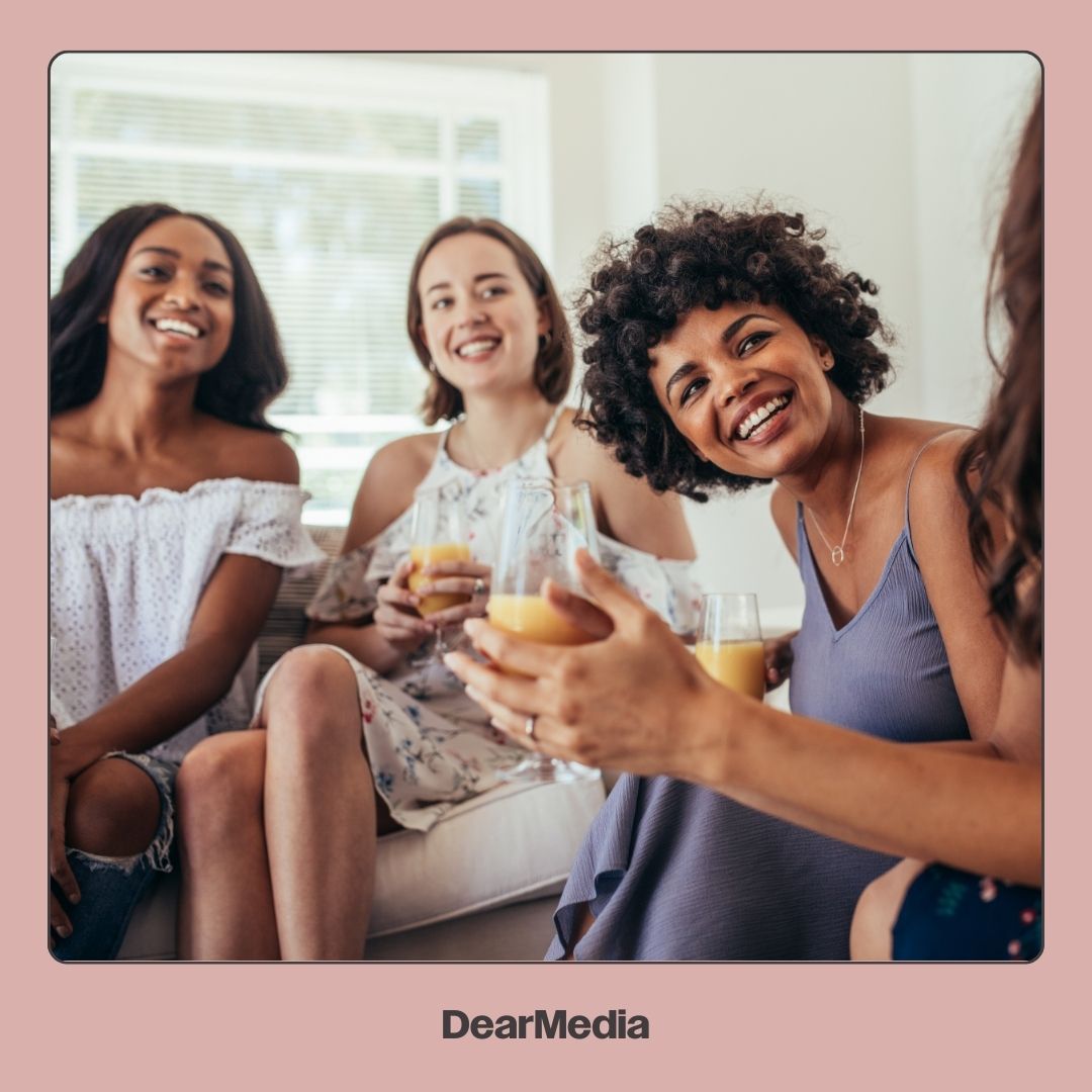 Group of mom friends drinking and laughing